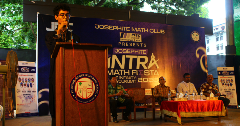 Tawhid Bin Omar leading a mathematics problem-solving workshop at St. Joseph Higher Secondary School in Dhaka, Bangladesh — students working on Olympiad-level math problems on the whiteboard during a Math Club session.